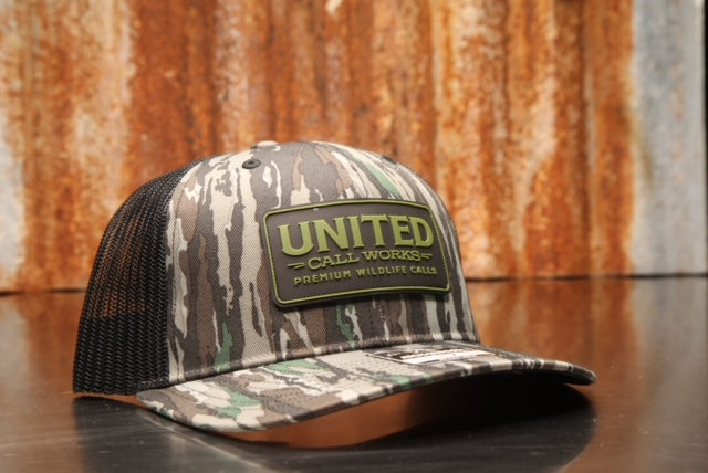 Original Realtree/Black Richardson 112 Trucker Hat with Black and green PVC Patch