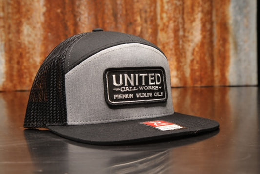 Heather Grey / Black Richardson 7 Panel Trucker Hat with Black and White Stitched Patch